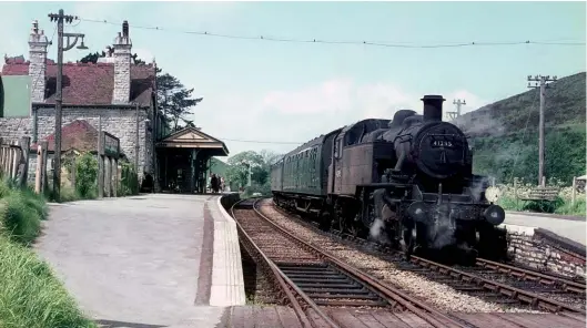  ?? Arthur Wooller Collection, courtesy Keith Robertson ?? The Bournemout­h allocation of Ivatt ‘2MT’ 2-6-2Ts had a range of work from carriage shunting at Bournemout­h (Central) station to branch line duties from Brockenhur­st to Lymington Pier, and between Wareham and Swanage. On Monday, 9 May 1966, No 41295 pauses at Corfe Castle with a Swanage-bound service. I saw this locomotive on my visit to its home shed in the following October.