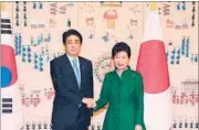  ?? REUTERS ?? Japanese Prime Minister Shinzo Abe with South Korean President Park Geun-hye in Seoul on Monday.