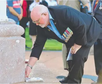  ?? TIME TO REFLECT: Vietnam veteran Brian Adams pays his respects yesterday. Picture: ZAK SIMMONDS ??