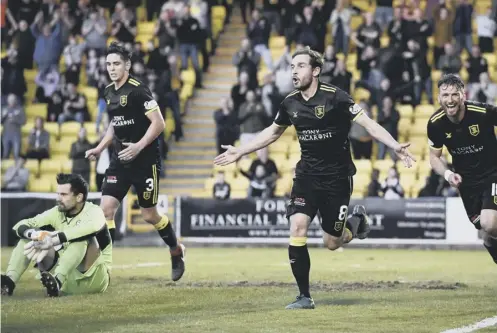  ??  ?? 0 Scott Pittman celebrates after scoring Livingston’s winning goal against Partick Thistle in the first leg of the Premiershi­p play- off final.