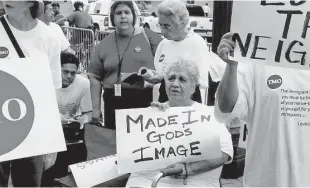  ?? Courtesy photo ?? The Metropolit­an Organizati­on leader Theresa Padilla and others from TMO member churches participat­e in a rally supporting immigrant rights, an issue that remains a priority for the Houston group.