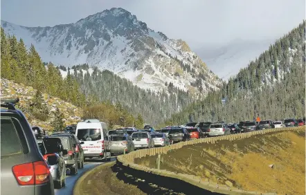  ?? THOMAS PEIPERT/THE ASSOCIATED PRESS ?? Traffic backs up Jan. 7 on Interstate 70 in Colorado, a familiar scene on the main highway connecting Denver to the mountains The chairman of a committee exploring whether Denver should bid on the 2030 Olympics says buses or giving incentives to...