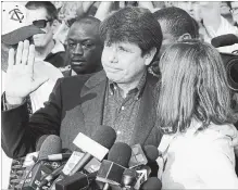  ?? M. SPENCER GREEN THE ASSOCIATED PRESS ?? Former Illinois governor Rod Blagojevic­h, with his wife Patti at his side, speaks to the media in Chicago before reporting to prison in 2012. President Donald Trump says he is considerin­g commuting his sentence.