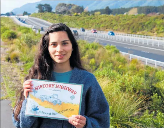  ?? PHOTO: ROSALIE WILLIS ?? Shirani Wildbore holding her published children’s book based on her experience­s living near the expressway developmen­t.