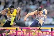  ??  ?? Hansle Parchment of Jamaica and Andrew Pozzi of Great Britain compete in the Men’s 110 metres hurdles semi finals. (Photo by David Ramos/Getty Images)