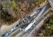  ?? THE ASSOCIATED PRESS ?? The wreckage of an Amtrak train, bottom, and a CSX freight train lie next to the tracks in Cayce, S.C., on Feb. 4.