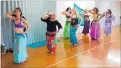  ?? PHOTO / IMRAN ALI ?? Eva Corne, second left, leads the Nur and Tiny Camel Belly Dance groups during a rehearsal for the upcoming variety show.