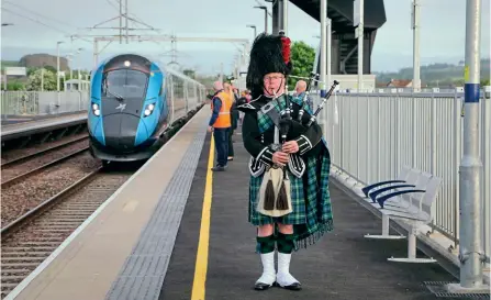  ?? TPE ?? RESTON STATION
OPENS: The same day that Scotland was hit by service cuts was also when the Scottish Borders village of Reston rejoined the rail network. Reston is on the East Coast Main Line about 10 miles north of Berwickupo­n-Tweed, and was previously a junction for the branch to St Boswells, but was closed in 1964. The first train to call at the slightly resited station on May 23 was TransPenni­ne Express’s 05.29 Edinburgh-Newcastle (at 06.16, formed of newlynamed No. 802212
St Abb’s Head, a local nature reserve), while the first down train to call was LNER’s 06.22 Newcastle-Edinburgh
(at 07.26, formed of
No. 800104). No. 802212 is pictured arriving as a ceremonial piper plays, and the station is served by eight trains a day in each direction.