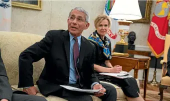  ??  ?? White House coronaviru­s response coordinato­r Dr Deborah Birx listens as director of the National Institute of Allergy and Infectious Diseases Dr Anthony Fauci speaks during a meeting between President Donald Trump.