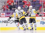  ?? NICK WASS/ASSOCIATED PRESS ?? Pittsburgh’s Sidney Crosby (87) celebrates one of his second-period goals in the Penguins’ Game 1 victory against the Capitals in Washington on Thursday night.