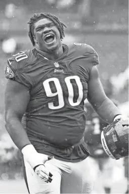  ?? BILL STREICHER/USA TODAY SPORTS ?? Eagles defensive tackle Jordan Davis celebrates after a victory against the Jaguars on Oct. 2 in Philadelph­ia.