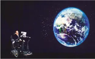  ?? — AFP ?? Renowned physicist Stephen Hawking speaks to an audience by hologram in Hong Kong, beamed live from his office in Cambridge, England.