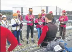  ?? FM4713697 ?? Abseilers are briefed before the KM Abseil Challenge