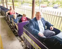  ?? PATRICK CONNOLLY/ORLANDO SENTINEL PHOTOS ?? Richard Glover, CEO of Central Florida Zoo and Botanical Gardens, unveils a new train attraction on Thursday in Sanford. Glover says many people asked when it would return.