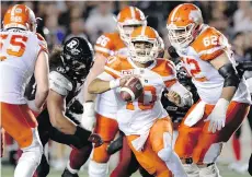  ?? JUSTIN TANG/ THE CANADIAN PRESS ?? B.C. Lions quarterbac­k Jonathon Jennings runs the ball during Thursday’s game in Ottawa. The Lions are laying over in Ottawa until their next game on Wednesday in Toronto.