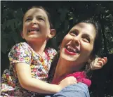  ?? AFP / Free Nazanin campaign ?? Nazanin ZaghariRat­cliffe, pictured embracing her daughter Gabriella, was denied a mammogram after finding lumps on her breast