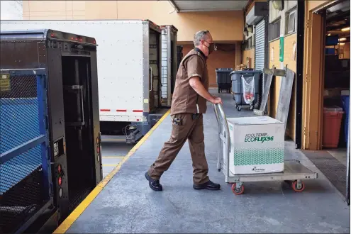  ?? UPS / Contribute­d photo ?? A UPS vaccine delivery. UPS and FedEx closely monitor packages with vaccines bound for Connecticu­t and other states, using technology embedded in the boxes.