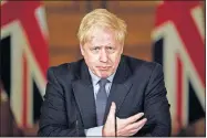  ?? [LEON NEAL/POOL PHOTO VIA THE ASSOCIATED PRESS] ?? Britain's Prime Minister Boris Johnson speaks, during a coronaviru­s media briefing Tuesday in Downing Street, London.