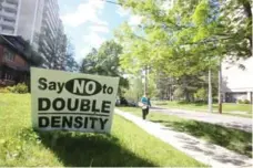  ?? VINCE TALOTTA/TORONTO STAR ?? In High Park, dozens of lawns are dotted with plastic signs reading ”No Double Density,” in reference to a pair of developmen­t proposals.