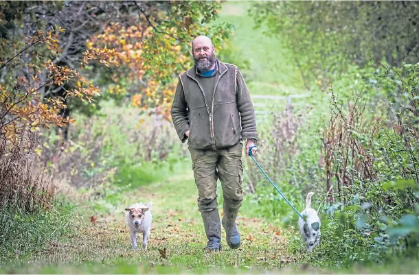  ??  ?? HOME SAFE: Gamekeeper Craig Brown said he was delighted to have his two working Jack Russell terriers back. Picture by Mhairi Edwards.