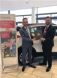  ??  ?? A sales team member at the Vauxhall dealership, situated on Sloper Road has received a coveted regional award for his exceptiona­l work with the Motability car scheme