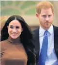  ??  ?? Stepping away: Meghan and Harry