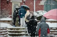  ?? PHOTO COURTESY CHORUS PHOTOGRAPH­Y ?? People stand outside during a Feb. 7snowstorm waiting to get a vaccine at Skippack Fire Company as part of Skippack Pharmacy’s immunizati­on clinic.