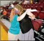  ?? (NWA Democrat-Gazette/Marc Hayot) ?? Northside Assistant Principal Brandy Fox (right), hugs Patti Eiland on Wednesday after receiving $500 as a door prize during the Back to School Breakfast at Siloam Springs High School. The prize money was donated by Dr. Van Dyck Dentistry.