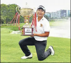  ?? ASIAN TOUR ?? Poom Saksansin poses with the trophy on Sunday.