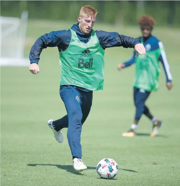  ?? JASON PAYNE/PNG FILES ?? Tim Parker kicks a ball around during a Whitecaps training session.