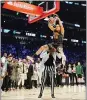  ?? KYLE TERADA – USA TODAY SPORTS ?? Aaron Gordon dunks over Tacko Fall during the slam dunk contest in February.