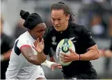  ?? PHOTO: GETTY IMAGES ?? Black Ferns tryscoring machine Portia Woodman blasts through the United States defence during New Zealand’s semifinal win.