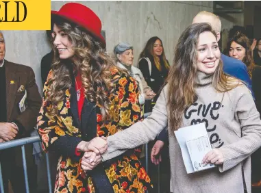  ?? ROY ROCHLIN / GETTY IMAGES ?? Actresses Lauren Young, left, and Jessica Mann walk out of the courthouse in Manhattan on Wednesday after
former movie mogul Harvey Weinstein was sentenced to 23 years in prison for sexual assault and rape.