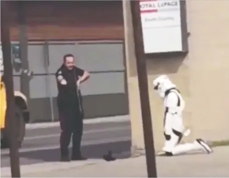  ??  ?? A woman who dresses in a Star Wars stormtroop­er costume at her Star Wars-themed restaurant job was arrested by Lethbridge police on Monday.