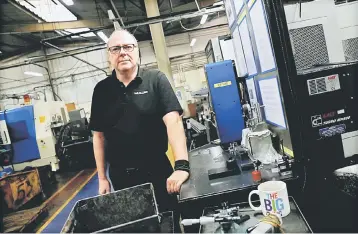  ?? – Reuters photo ?? Muller managing director Adam Cunningham poses at the manufactur­ing facility in Redditch, Britain.