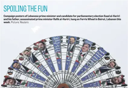  ?? Picture: Reuters ?? Campaign posters of Lebanese prime minister and candidate for parliament­ary election Saad al-Hariri and his father, assassinat­ed prime minister Rafik al-Hariri, hang on Ferris Wheel in Beirut, Lebanon this week.