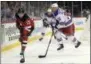  ?? BILL KOSTROUN - THE ASSOCIATED PRESS ?? FILE - In this Sept. 17, 2018, file photo, New Jersey Devils center Nico Hischier (13) passes the puck as New York Rangers defenseman Fredrik Claesson (33) defends during the second period of an NHL hockey game in Newark, N.J.