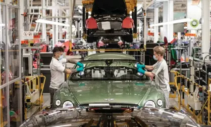  ??  ?? Production has begun again at luxury carmaker Bentley at their factory in Crewe, although about a quarter of staff remain furloughed. Photograph: Bentley Motors