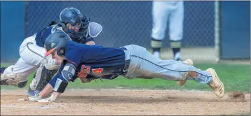  ?? TERRY PIERSON — STAFF PHOTOGRAPH­ER ?? Yucaipa catcher Brendon Saenz tags out Roosevelt catcher Carter Rugg (4) as he dives for home in Tuesday’s game.