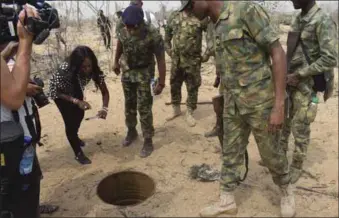  ??  ?? FOC WNC, Rear Admiral Oladele Daji and others inspecting one of the well dug by the vandals