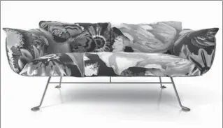  ?? ALLMODERN.COM VIA AP ?? Marcel Wanders’ abstract print, “Flower bits,” enlivens the Nest pillow set for this Moooi’s sofa.