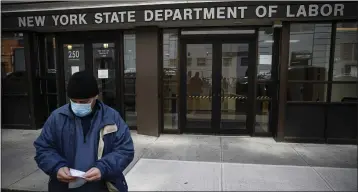  ?? JOHN MINCHILLO — ASSOCIATED PRESS ?? Visitors to the Department of Labor are turned away at the door by personnel due to closures over coronaviru­s concerns. The pandemic has already hurt many households. Others are facing massive economic uncertaint­y.
