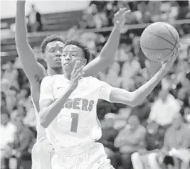  ?? MICHAEL LAUGHLIN/SUN SENTINEL ?? Ely’s Jayden Fye drives past Miramar’s Pete Laidely during the first half Friday.