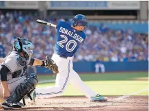  ?? FRANK GUNN/ THE CANADIAN PRESS ?? Blue Jays' Josh Donaldson swings through on his walk- off home run in the ninth inning of Toronto's 5- 4 comeback victory over Tampa Bay at the Rogers Centre on Sunday.