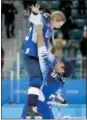  ?? JULIO CORTEZ — THE ASSOCIATED PRESS ?? Kendall Coyne, top, of the United States, is hoisted by her fiance Michael Schofield as they celebrate on the ice after the U.S. beat Canada in the women’s gold medal hockey game at the 2018 Winter Olympics in Gangneung, South Korea, Thursday.