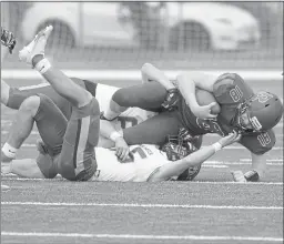  ?? SHERRY LAVARS — MARIN INDEPENDEN­T JOURNAL ?? Redwood quarterbac­k Brady Weingart is sacked by San Marin defenders DJ Bishop, front, and Nicholas Tyler during their game at Redwood High in Larkspur on Saturday.