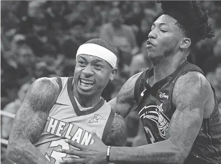  ?? PHELAN M. EBENHACK/THE ASSOCIATED PRESS ?? Point guard Isaiah Thomas, left, is one of several veterans traded from Cleveland before Thursday’s NBA deadline. Thomas is now a Los Angeles Laker, while fellow point guard Elfrid Payton, right, was sent from the Orlando Magic to the Phoenix Suns.