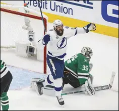  ?? Canadian Press ?? WINNERS Tampa Bay Lightning’s Pat Maroon (14) reacts as the puck goes in past Dallas Stars goalie Anton Khudobin (35) on a shot from Lightning’s Blake Coleman (not shown) during the second period of the Stanley Cup Final in Edmonton, Alberta, on Monday.