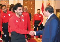  ?? Reuters ?? Egyptian President Abdel Fattah Al Sisi shakes hands with Mohamed Salah and members of the Egypt’s national team before travelling to Russia. —