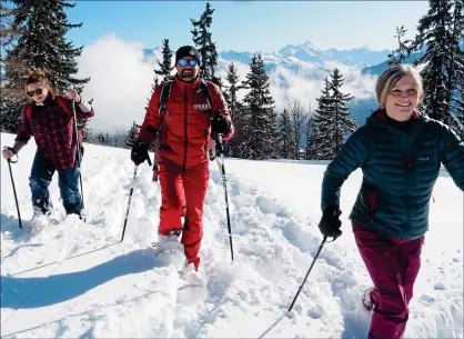  ??  ?? ALL DOWNHILL FROM HERE: Catherine, right, samples snowshoein­g in the Valais region of Switzerlan­d